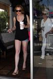 Lindsay Lohan shows legs in short denim shorts and black top as she and Samantha Ronson have a burger in Hollywood