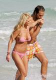Tara Reid banged-up bod in pink-striped bikinis at a beach in Miami
